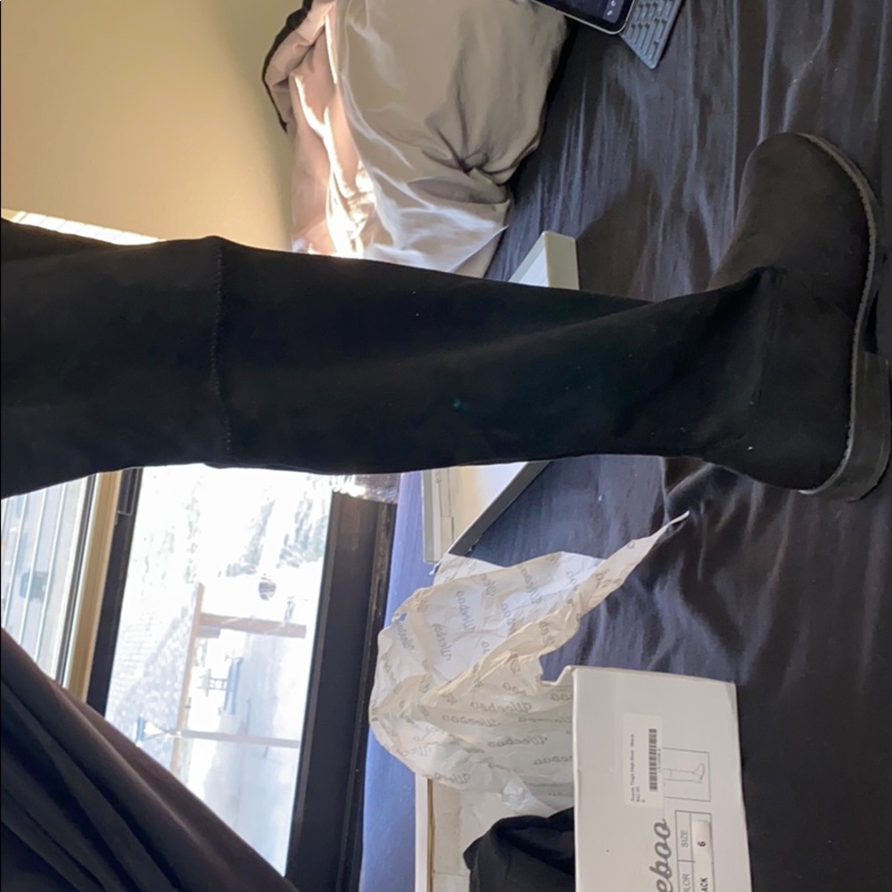 Black thigh high boots